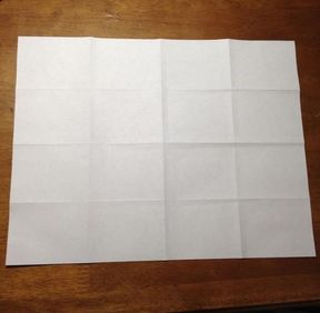 Paper folded into 16 equal rectangles